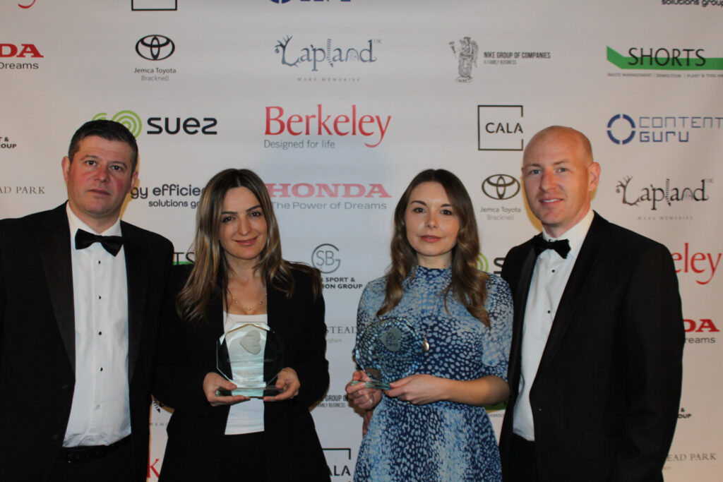 Picture of four Pride of Bracknell Forest Awards winners, two of which are holding a trophy