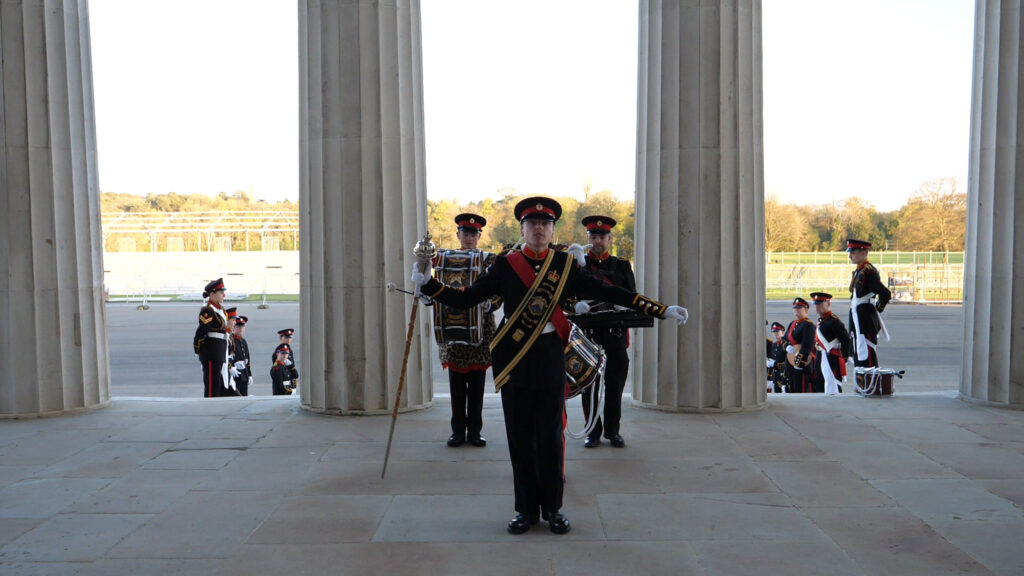 Picture of Sandhurst & District Corps of Drums on the stairs of the old college at RMA Sandhurst